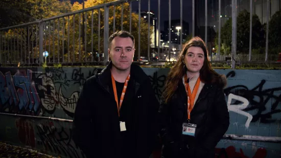 Two members of Centrepoint’s Rough Sleepers Initiative Team working at night to support homeless people on the streets