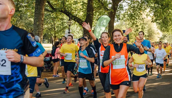 People running for Centrepoint through park