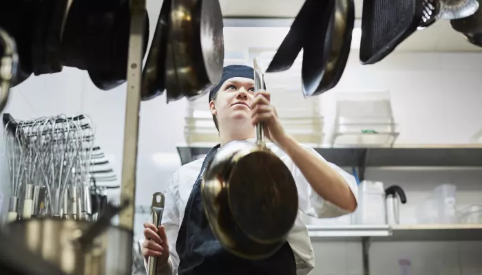 Young person working in a kitchen 