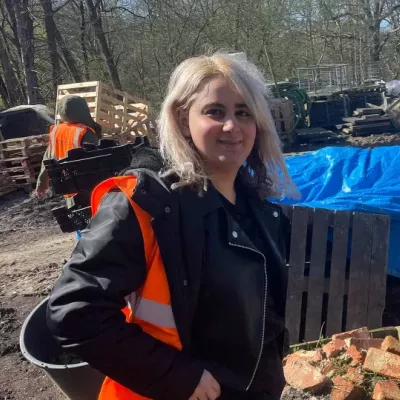 Young person outside in high vis