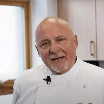 Aldo Zilli in white in a kitchen