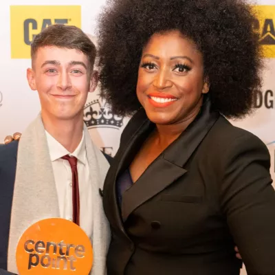 Mica Paris and award winner smiling at camera