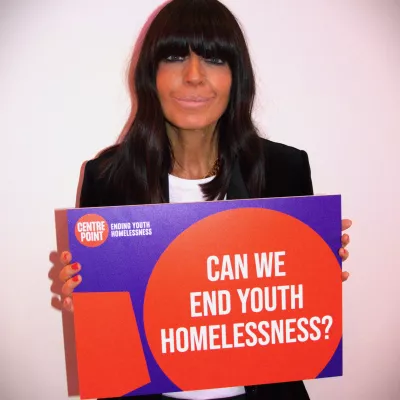 Claudia Winkleman shows her support for Centrepoint and holds a banner with the words "Can we end youth homelessness?"