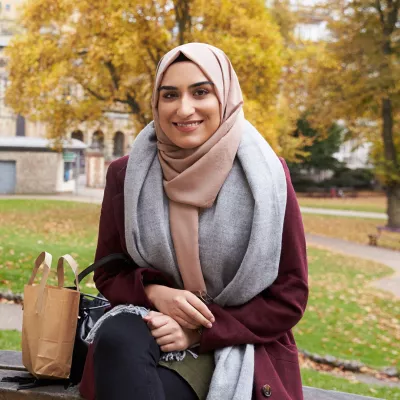 Young person sitting on a bench