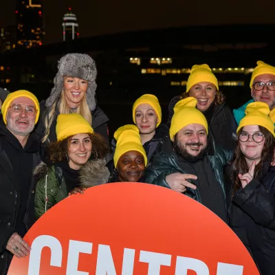 Selfridges staff take part in Sleep Out for Centrepoint wearing matching yellow beanie hats