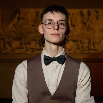 Young person wearing bow tie and waistcoat